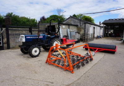 Mitsubishi D1650 compact tractor with new topper, roller and chain harrow