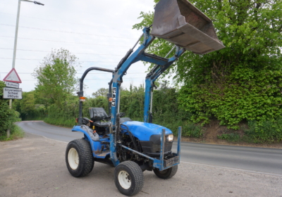 New Holland TC24D compact tractor with loader and bucket
